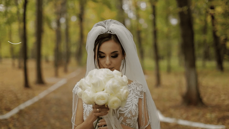 animated titles appearing with floral designs overlayed on top of a young woman in a wedding dress