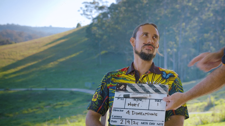 Laptop with email images floating around it